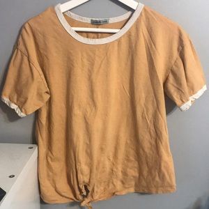 a tan shirt